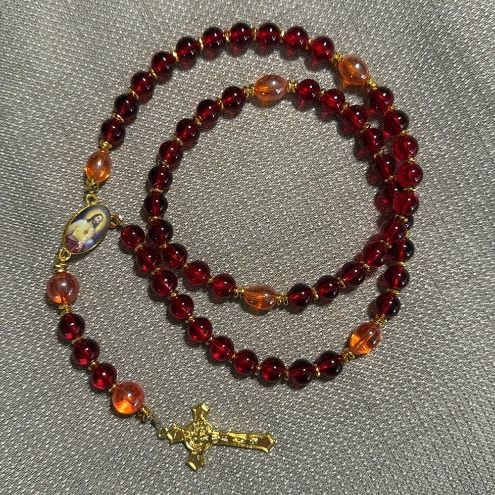Handmade Rosary. Red and orange glass beads and gold metal pieces.